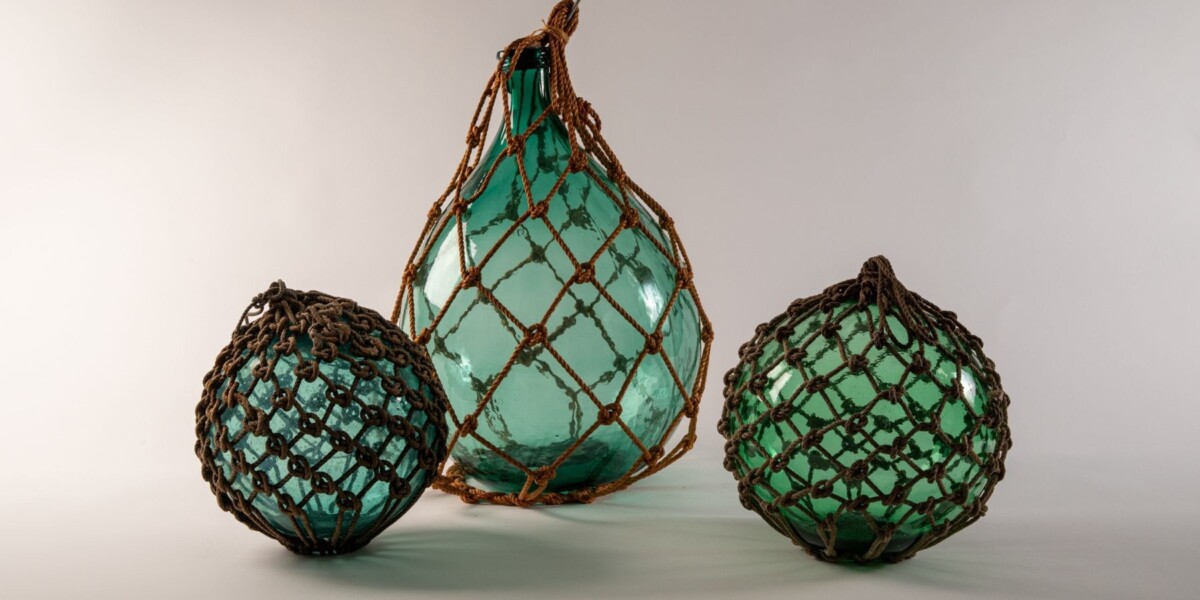 Unidentified Makers, Fishing Floats, 20th century. blown glass and hemp rope (asa). Japan.  various sizes.  Museum Purchase, 2001-38-001 and 2001-38-002; Gift of Yoshi Hug, 2003-41-001.