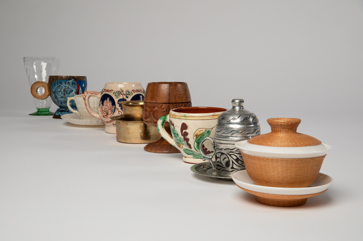 Objects for Japanese Matcha tea from Mingei International Museum's permanent collection. 
Image description: Various colorful tea instruments, including tea bowls, a water jar, chasen, matcha scoop, and brazier against a black background.