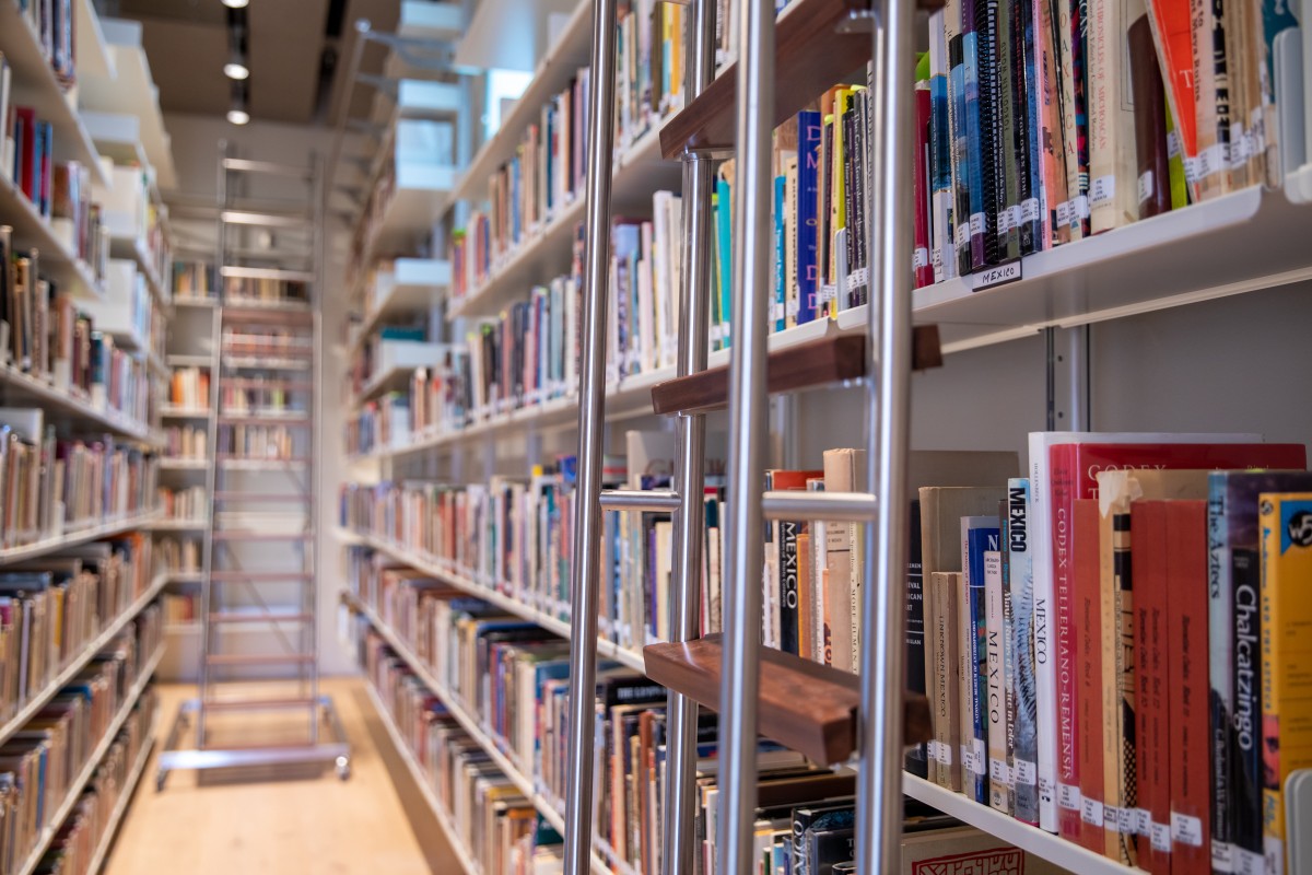 Stacks of books with ladder.