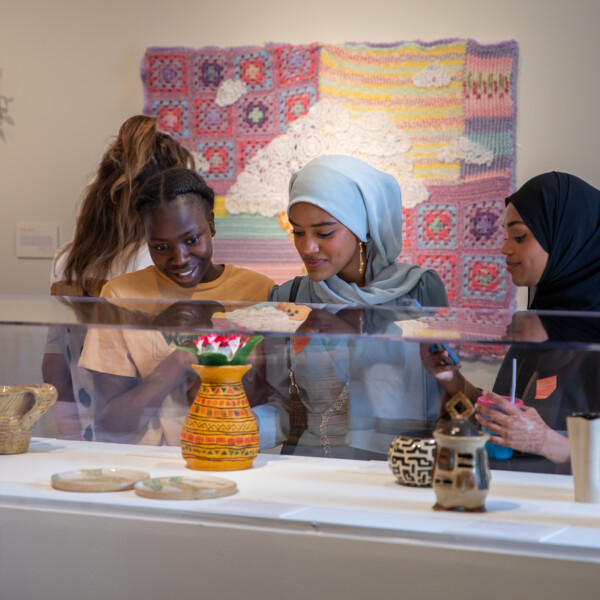 Students admiring works on display at opening reception