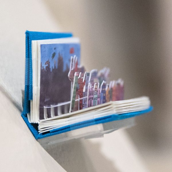 DIE STADT / THE CITY, H. Kurzke, 2012, Germany, miniature flutter book is printed in ParmaPetit Font with pigment ink. Collection of University of San Diego.